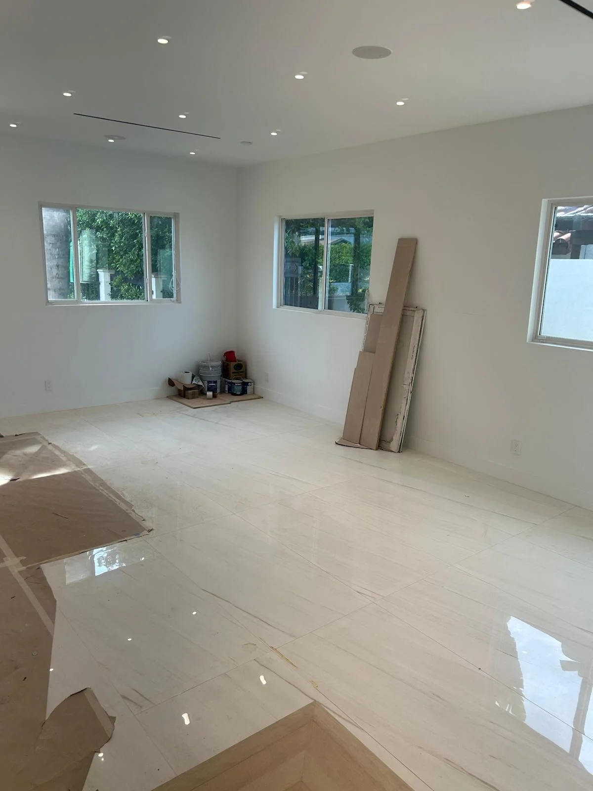 Sunlit living room with polished tile floors cleaned to a shine