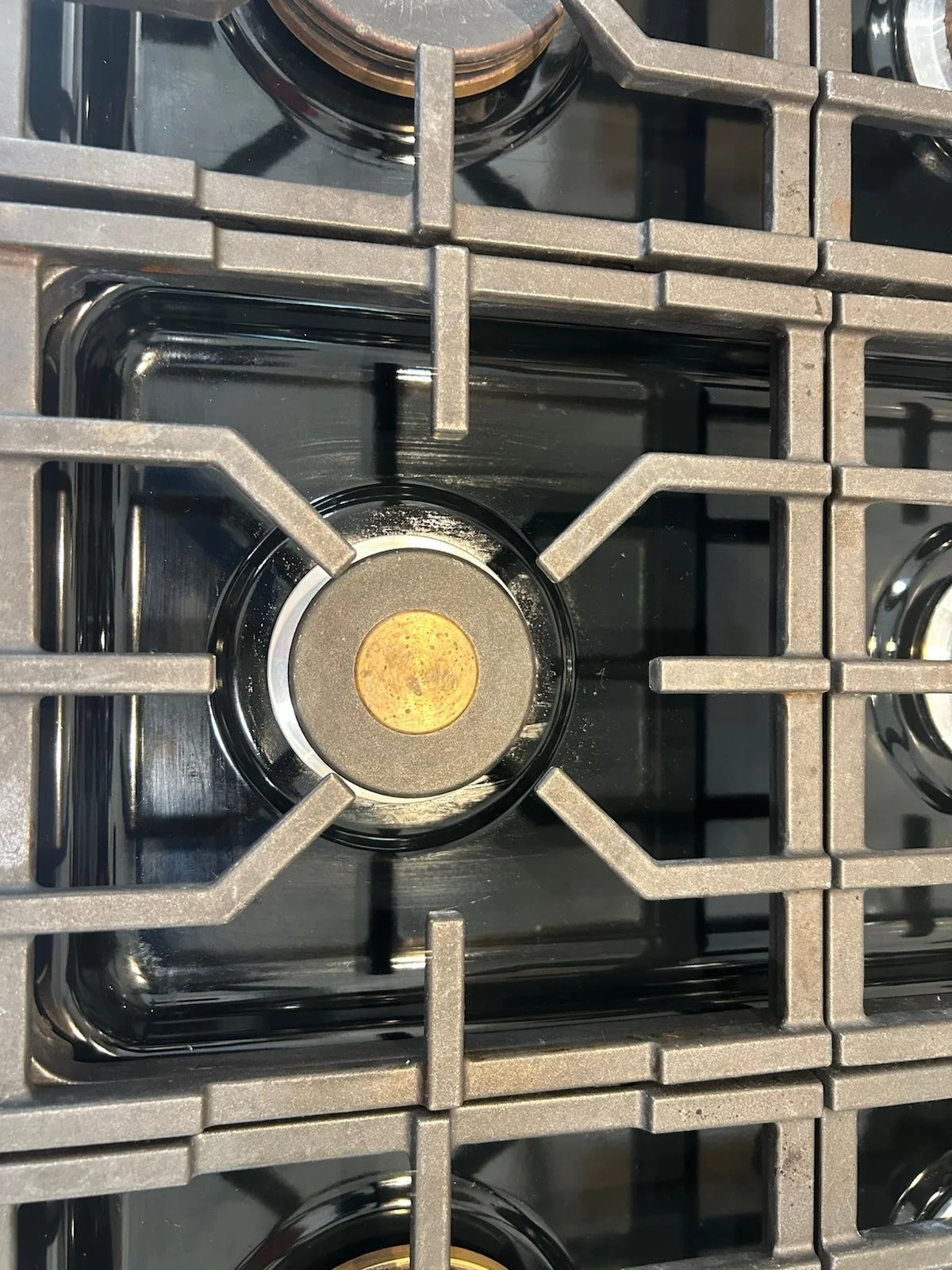 Gas cooktop grates degreased and detailed to the metal